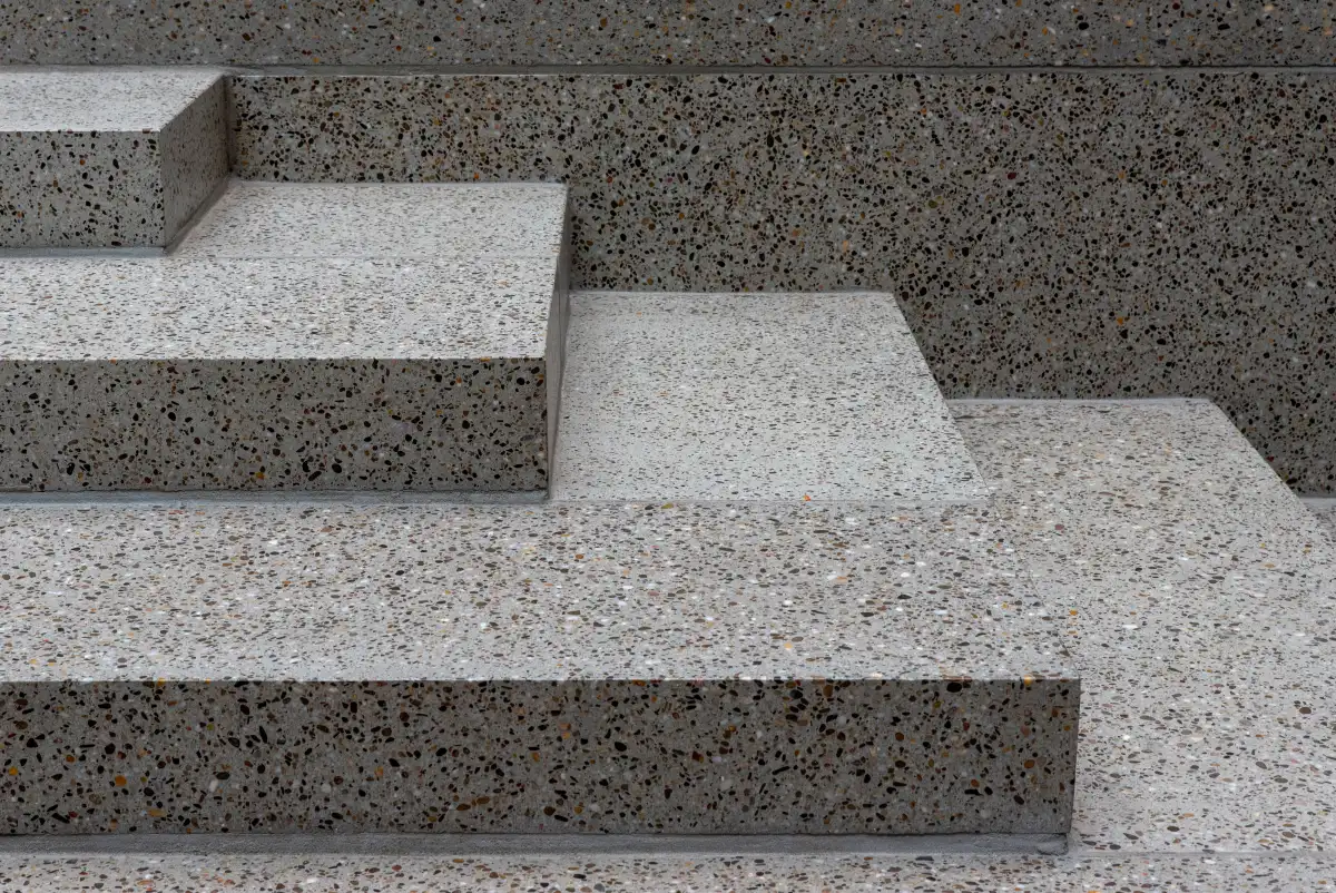 Aggregate terrazzo-style texture with visible chip broadcast