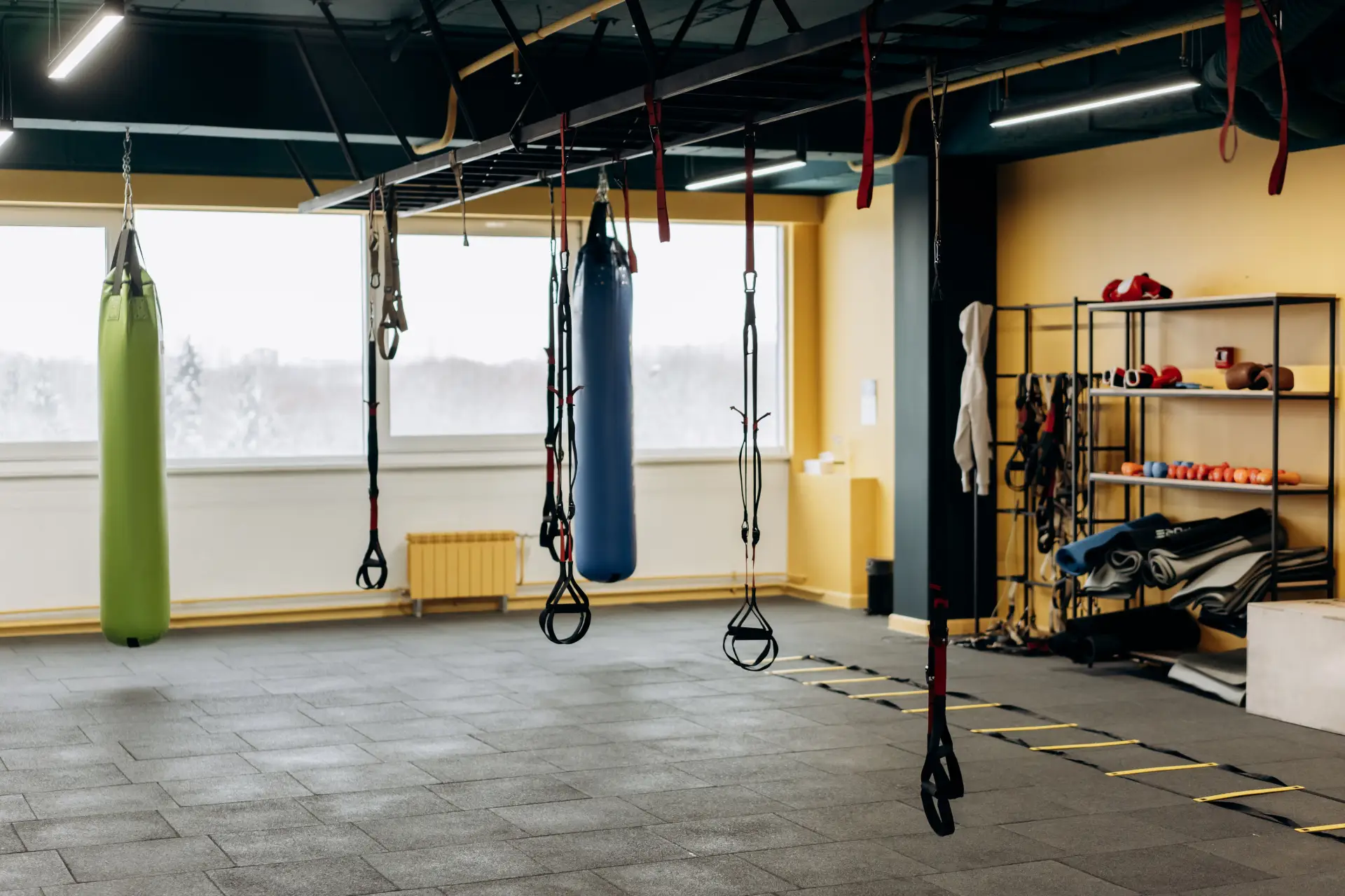 Gym interior with rubber flooring and fitness equipment