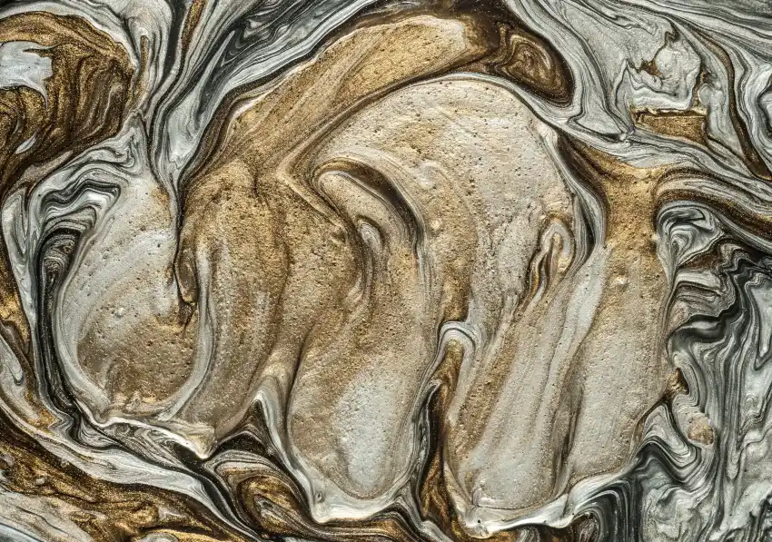 Close-up of a gold and bronze marbled metallic epoxy pattern